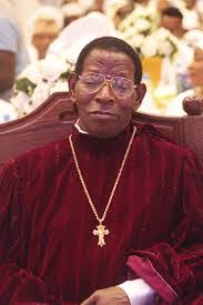 Senior shepherd in red liturgical vestments